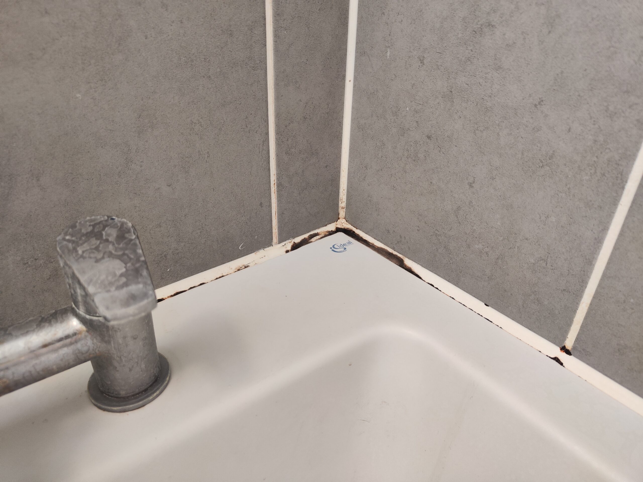 Before the bathroom mastic, sealant, silicone replacement, drity cracked silicone