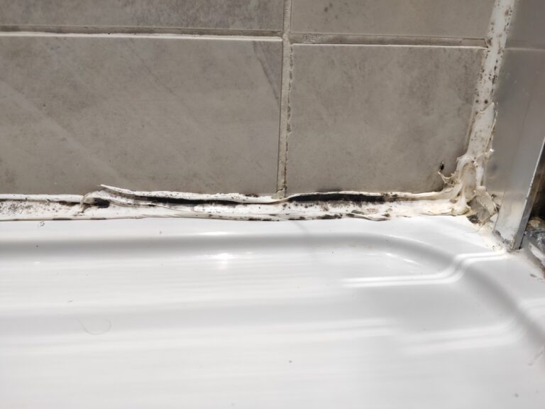 mouldy, cracked silicone, sealant needs replacement